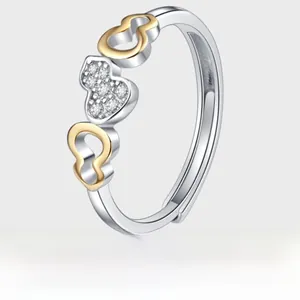 Detail of S925 silver gourd ring with micro-paved zircons and two-tone gold plating