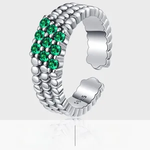Macro detail of S925 sterling silver ring featuring ten inlaid green zircon stones