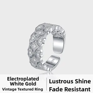 Detail of S925 sterling silver ring featuring retro embossed textures and zircon accents