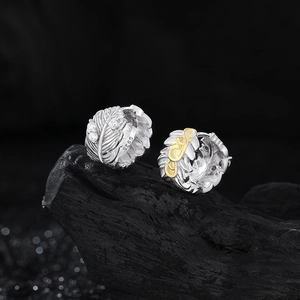 Boucles d'oreilles plume en argent 925 avec dorure partielle et pierres de zircon