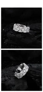Detailed macro view of S925 sterling silver hollow floral ring with zircon inlay