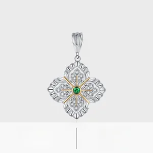Macro detail of S925 sterling silver clover pendant with green gem and gold accents