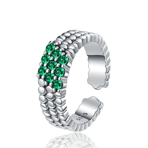 S925 sterling silver ring with textured band and nine green gems in a 45-degree angle view