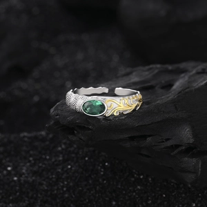 Retro S925 silver ring with green oval gemstone and gold floral relief on dark stone