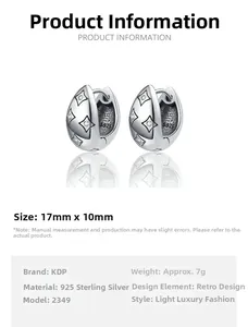 Macro detail of S925 sterling silver hoop earrings with star patterns and zircon inlays