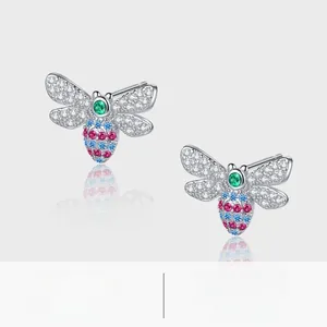 Macro shot of S925 silver bee stud earrings with colorful crystals and white diamonds