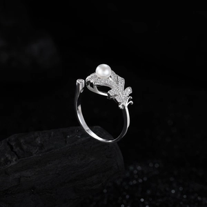 Elegant S925 sterling silver feather ring with a white pearl and sparkling pave diamonds