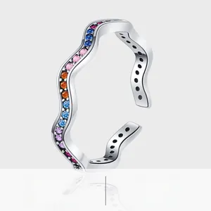 Detail of 925 sterling silver wave ring featuring multi-color gemstones in a platinum plating