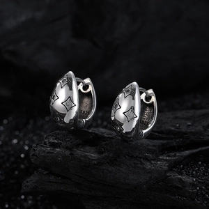 Retro S925 sterling silver hoop earrings featuring micro-set stars on black mineral stone