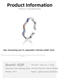 Detailed view of wave-shaped 925 sterling silver ring with colorful zircon inlays