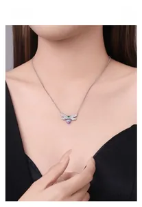 Detail of S925 silver bee necklace with colorful micro-inlaid crystals on model