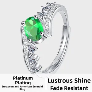 Detail of S925 sterling silver stamp on crown ring with emerald green zircon