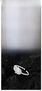 Close-up of S925 sterling silver Hamsa ring with zircon inlay and twisted band