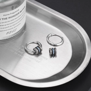 S925 sterling silver hoop earrings with detachable blue and clear zircon charms on tray