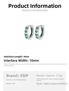 Macro detail of S925 sterling silver hoop earrings with heart green zircon 9mm x 10mm