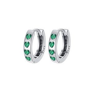 Detailed macro view of S925 sterling silver hoop earrings with heart-shaped green zircons