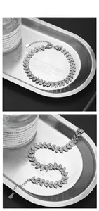 Detail of S925 silver bracelet with marquise-cut zircon leaves and lobster clasp