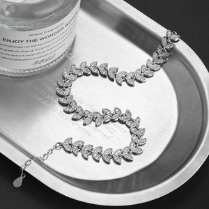 S925 sterling silver wheat ear bracelet with cubic zirconia on a sleek metal tray