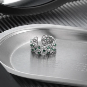 Retro S925 silver open ring with hollow woven texture and green zircon stones