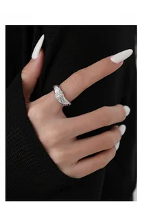 Detail of S925 sterling silver quilted ring featuring rainbow crystals and white zircons