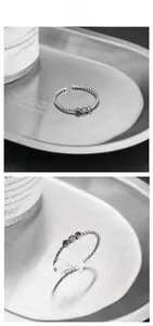 Detail of S925 silver rope ring with colorful zirconia stones and adjustable band