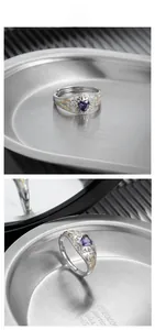 Close-up of S925 silver ring with purple heart gemstone and gold filigree details