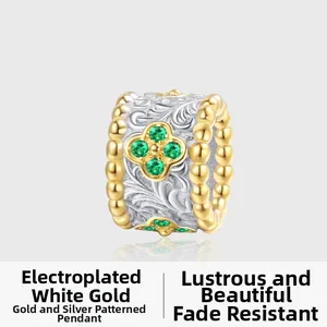 Detail of S925 silver four-leaf clover pendant with green zircon and floral engraving