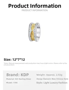 Detailed view of S925 sterling silver ring with gold textured layer and paved crystals
