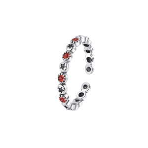 Close-up of S925 silver ring featuring red gemstones and black vintage star patterns