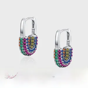 Macro shot of silver padlock earrings featuring rainbow micro-pave colored zircons