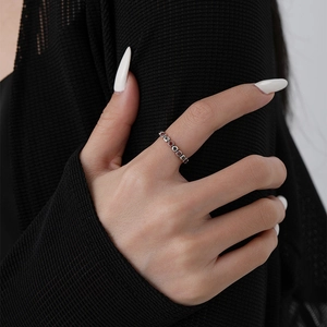 S925 sterling silver star ring with red and white zircons on a model hand