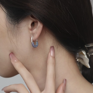 U-shaped S925 sterling silver hoop earrings with multicolored micropave crystals on model