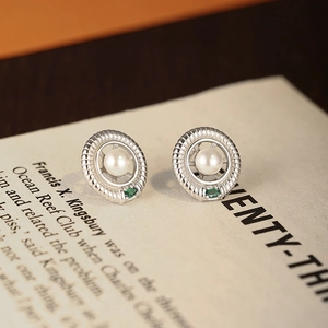 S925 silver pearl emerald stud earrings with vintage rope design on retro book page