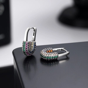 S925 silver safety pin earrings with multi-color micro-pave zircons on a black surface