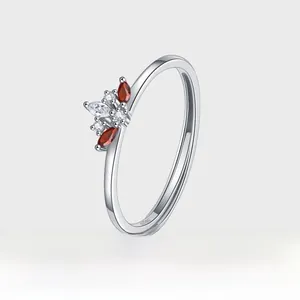 Close-up of S925 sterling silver crown ring with marquise red rubies and white zircons