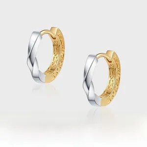 Detail of S925 silver two-tone Mobius earrings with intricate interior hollow carvings