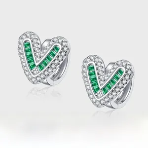 Detail of heart-shaped S925 silver earrings with emerald-cut stones and zircon inlay
