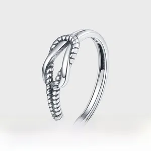 Close-up of S925 sterling silver ring showing intricate woven knot texture and stamp