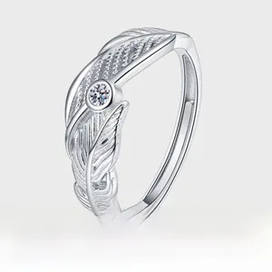 Detailed macro view of S925 silver feather ring with sparkling diamond inlay