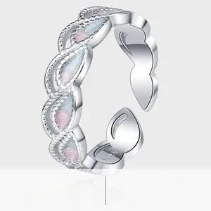 Detail view of S925 sterling silver peacock ring with gradient enamel and wavy texture
