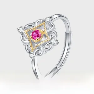 Detailed macro view of S925 silver hollow vintage ring with rose red gemstone and gold inlay