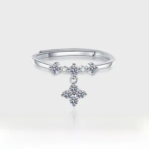 Detailed close-up of S925 sterling silver ring with cross star dangle and zircons