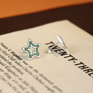 Sterling silver star stud earrings with green zircon and hollow clover design