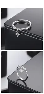 Macro view of S925 sterling silver ring with dangling sparkling star pendant and zircons