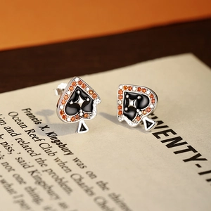 Ace of Spades 925 silver stud earrings with black enamel and orange zircon accents