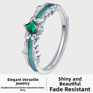 Macro shot of S925 silver ring featuring gradient enamel and square green gemstone