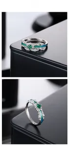 Macro detail of silver ring with green square gemstone and gradient enamel carving