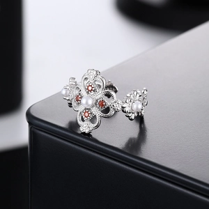 S925 sterling silver hollow clover ring with white pearls and red gemstones
