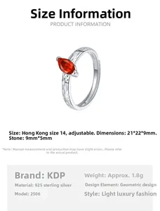 Detail of S925 sterling silver open ring with marquise cut red zircon stone setting