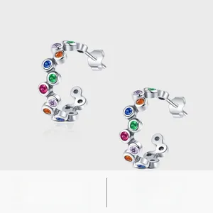 Detailed view of S925 sterling silver C-shaped earrings with colorful rainbow gemstones